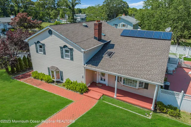 aerial view of a house with a yard