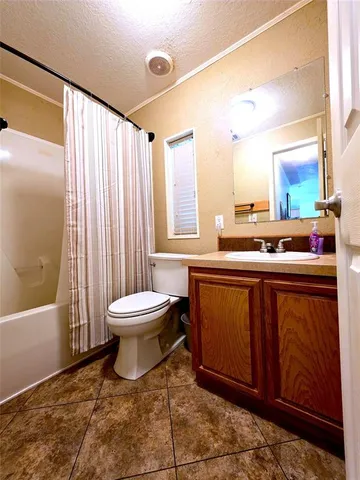a bathroom with a toilet a sink and a bathtub