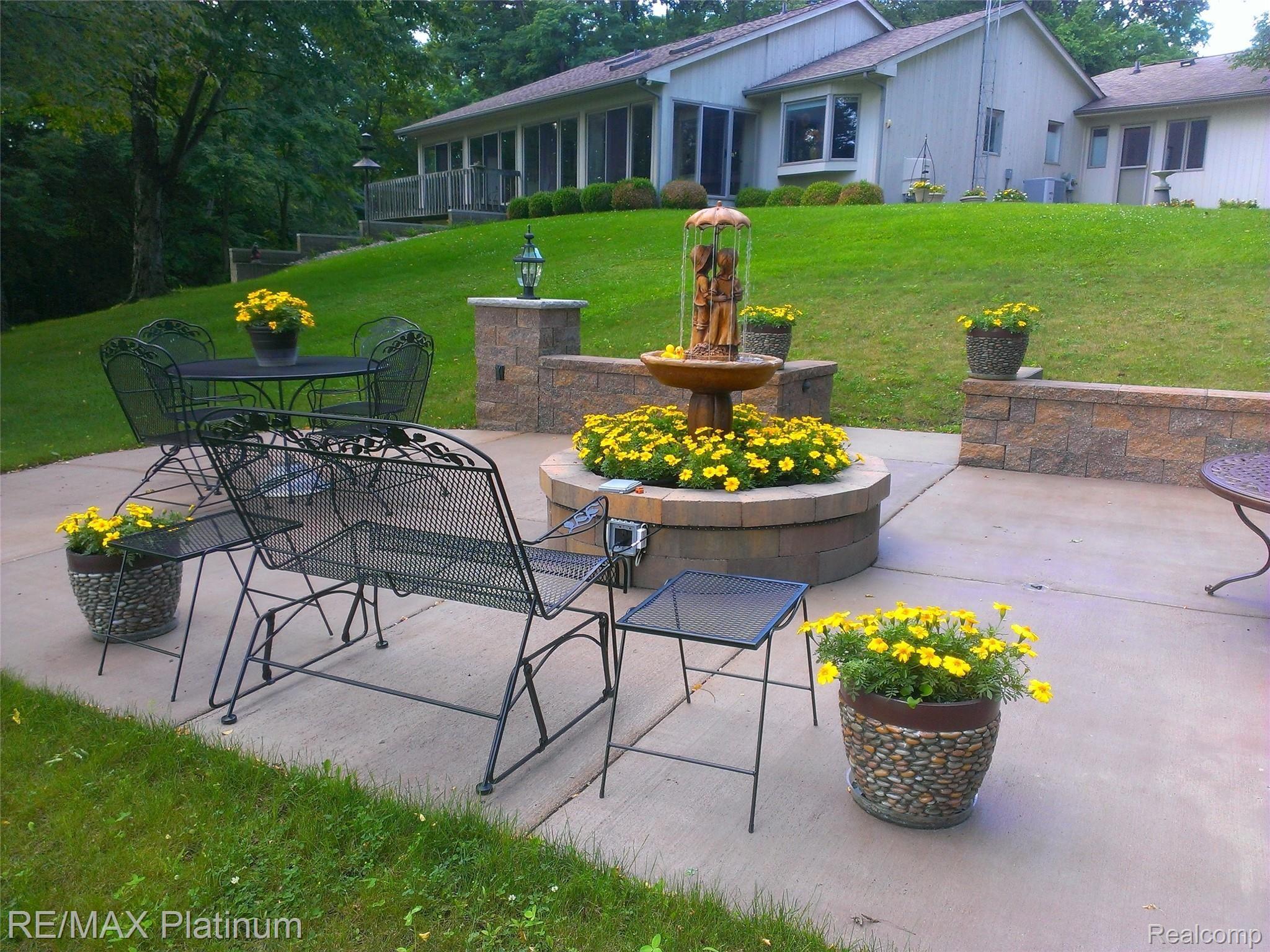 1848 Fox Ridge Drive Howell, MI 48843 - Photo 45 of 68 Bright Florals around the Fountain