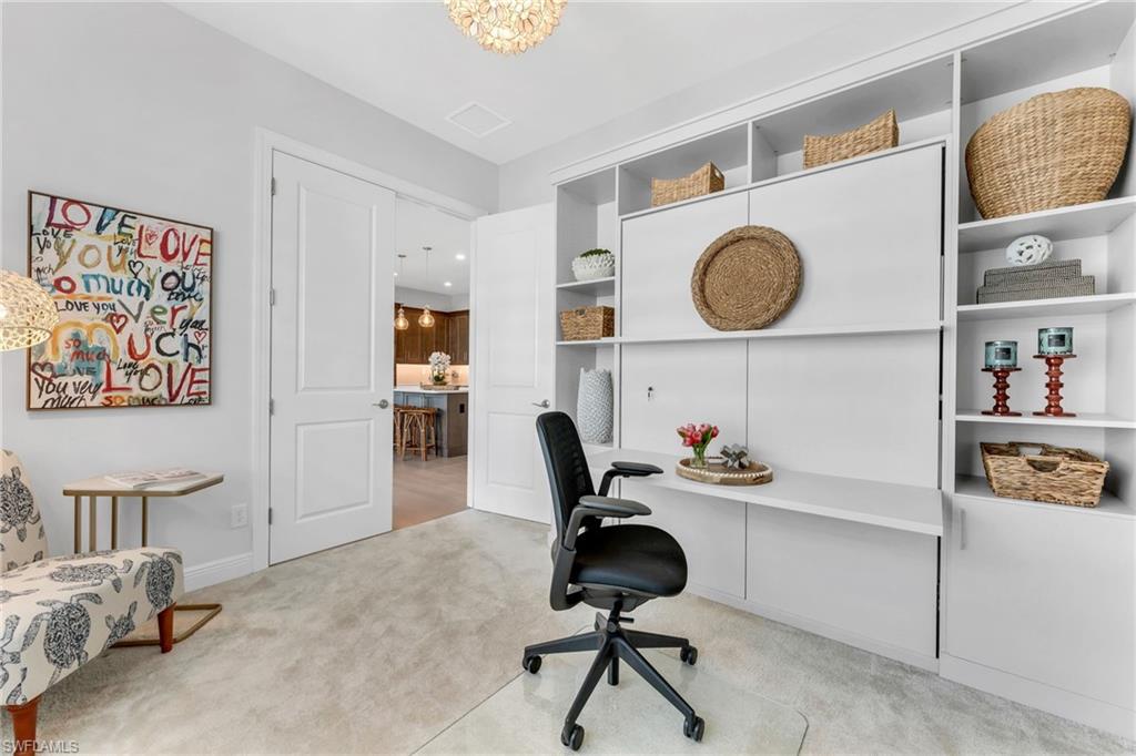 9028 Mayreau Way Naples, FL 34114 - Photo 11 of 24 a view of a workspace with furniture and a window