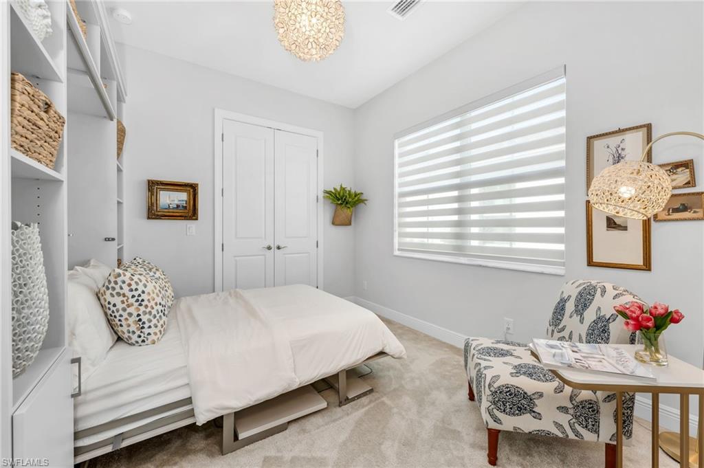 9028 Mayreau Way Naples, FL 34114 - Photo 12 of 24 a bedroom with a bed and a window
