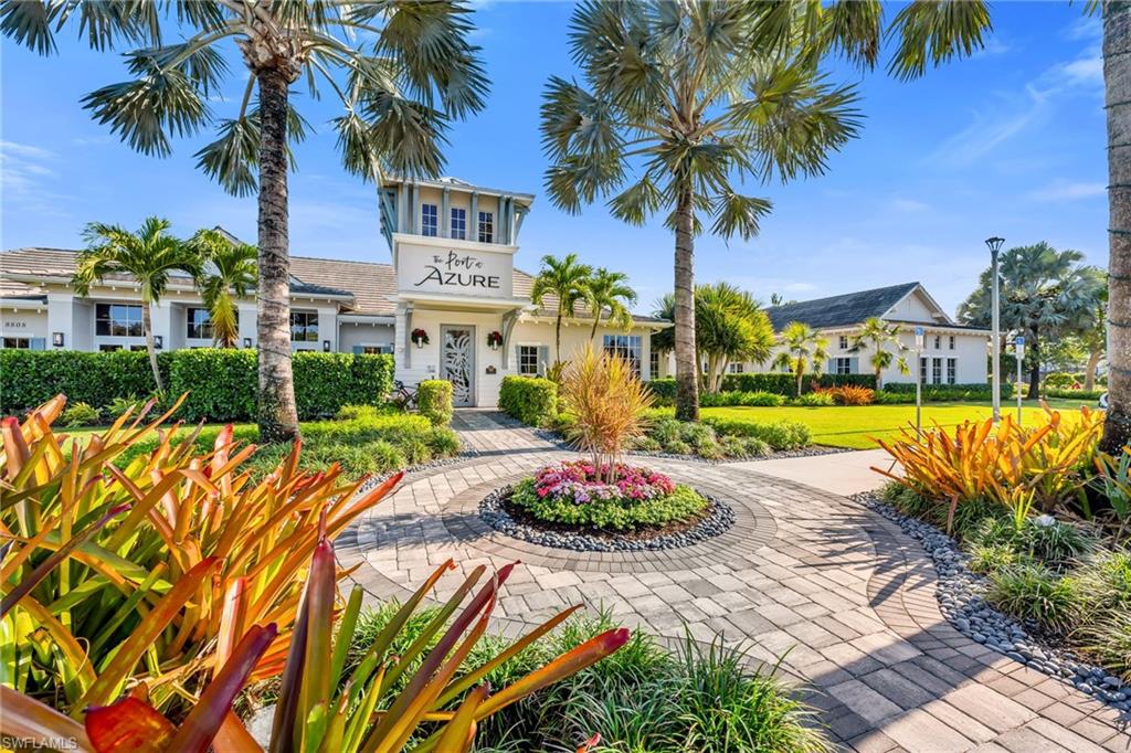 9028 Mayreau Way Naples, FL 34114 - Photo 18 of 24 a view of a swimming pool with a garden
