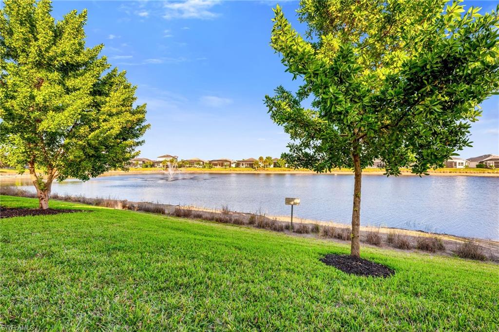9028 Mayreau Way Naples, FL 34114 - Photo 7 of 24 a view of yard with swimming pool and seating
