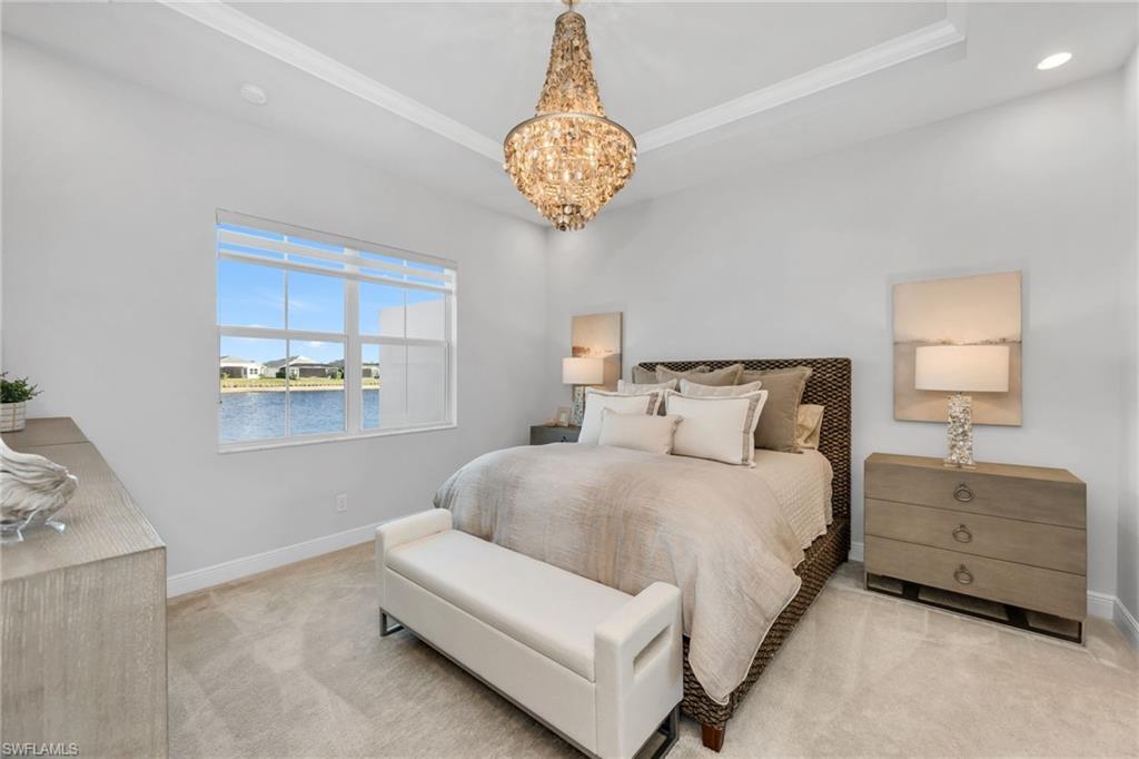 9028 Mayreau Way Naples, FL 34114 - Photo 8 of 24 a bedroom with a bed and a window