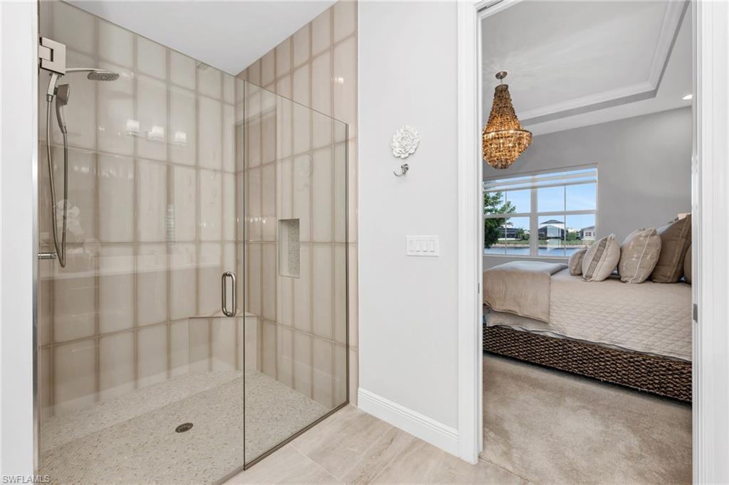 9028 Mayreau Way Naples, FL 34114 - Photo 10 of 24 a en suite bathroom with a shower