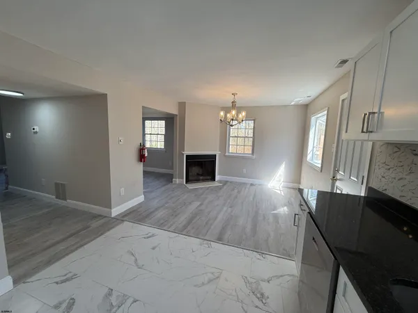 a view of a livingroom with furniture and wooden floor