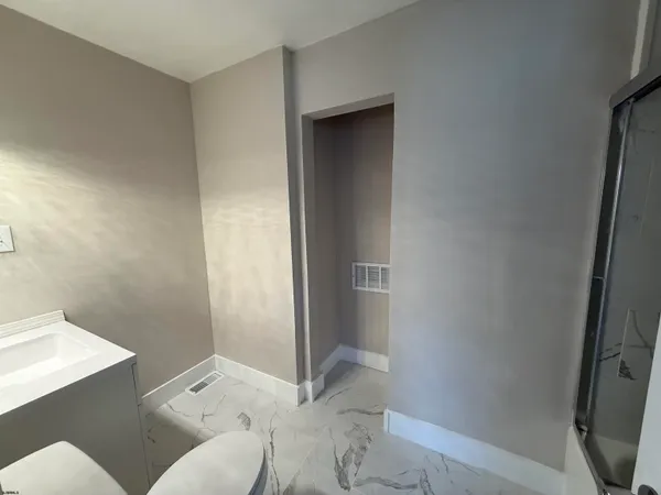 a bathroom with a sink and toilet