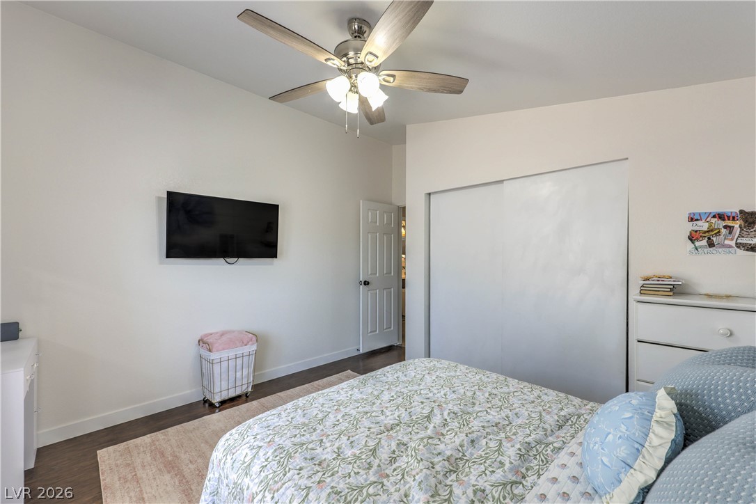 348 Tres Palomas Street Overton, NV 89040 - Photo 26 of 41 Relax in a comfortable bedroom featuring a ceiling fan, plush carpet, and ample closet space.