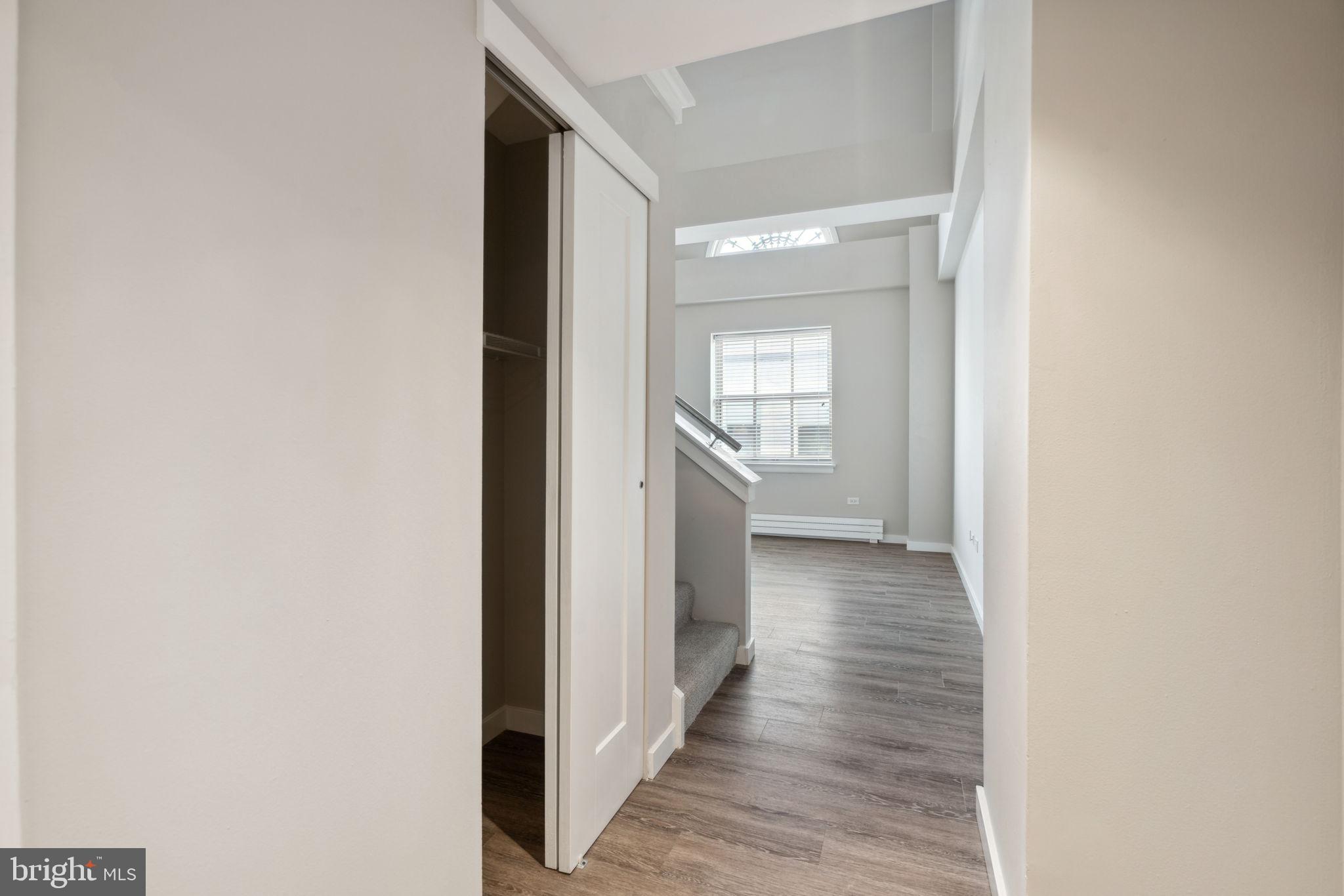 101-111 South 9th Street, Unit PH107 Philadelphia, PA 19107 - Photo 12 of 42 a view of a hallway with wooden floor
