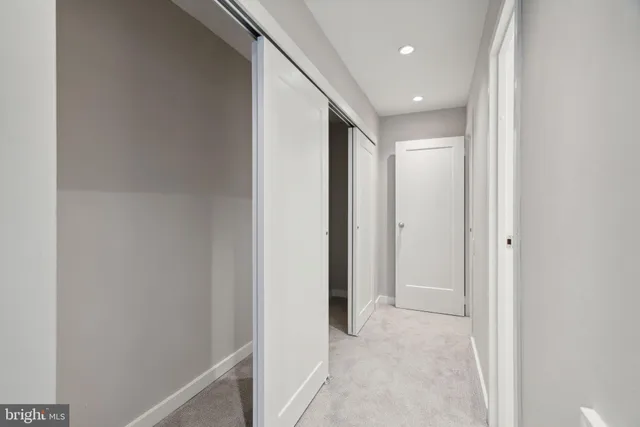 a view of hallway with stainless steel appliances