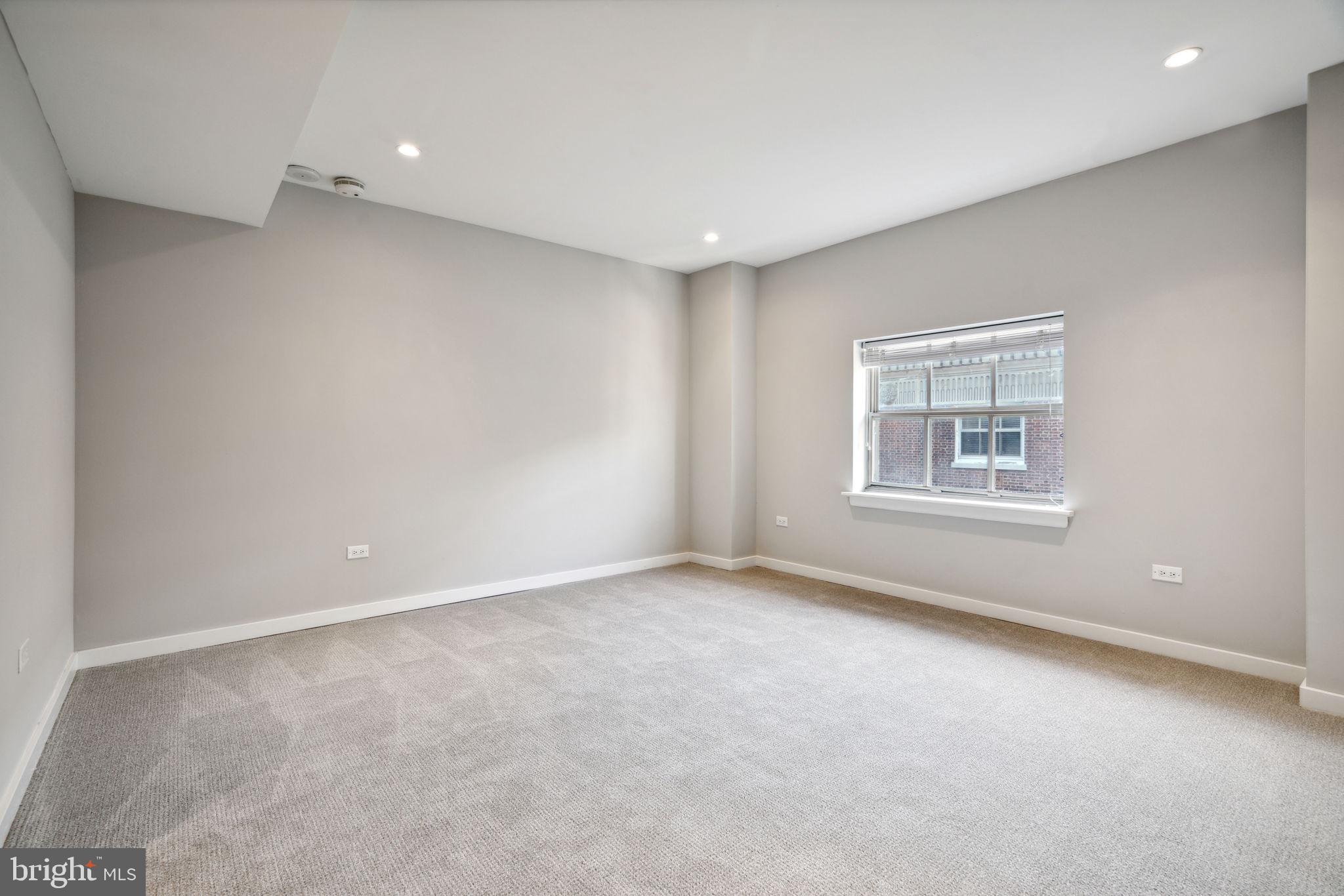101-111 South 9th Street, Unit PH107 Philadelphia, PA 19107 - Photo 24 of 42 a view of an empty room with a window