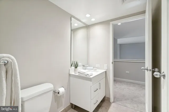 a bathroom with a toilet and a bathtub