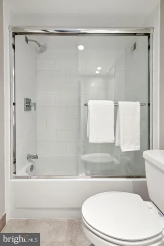 a view of a hallway with washer and dryer