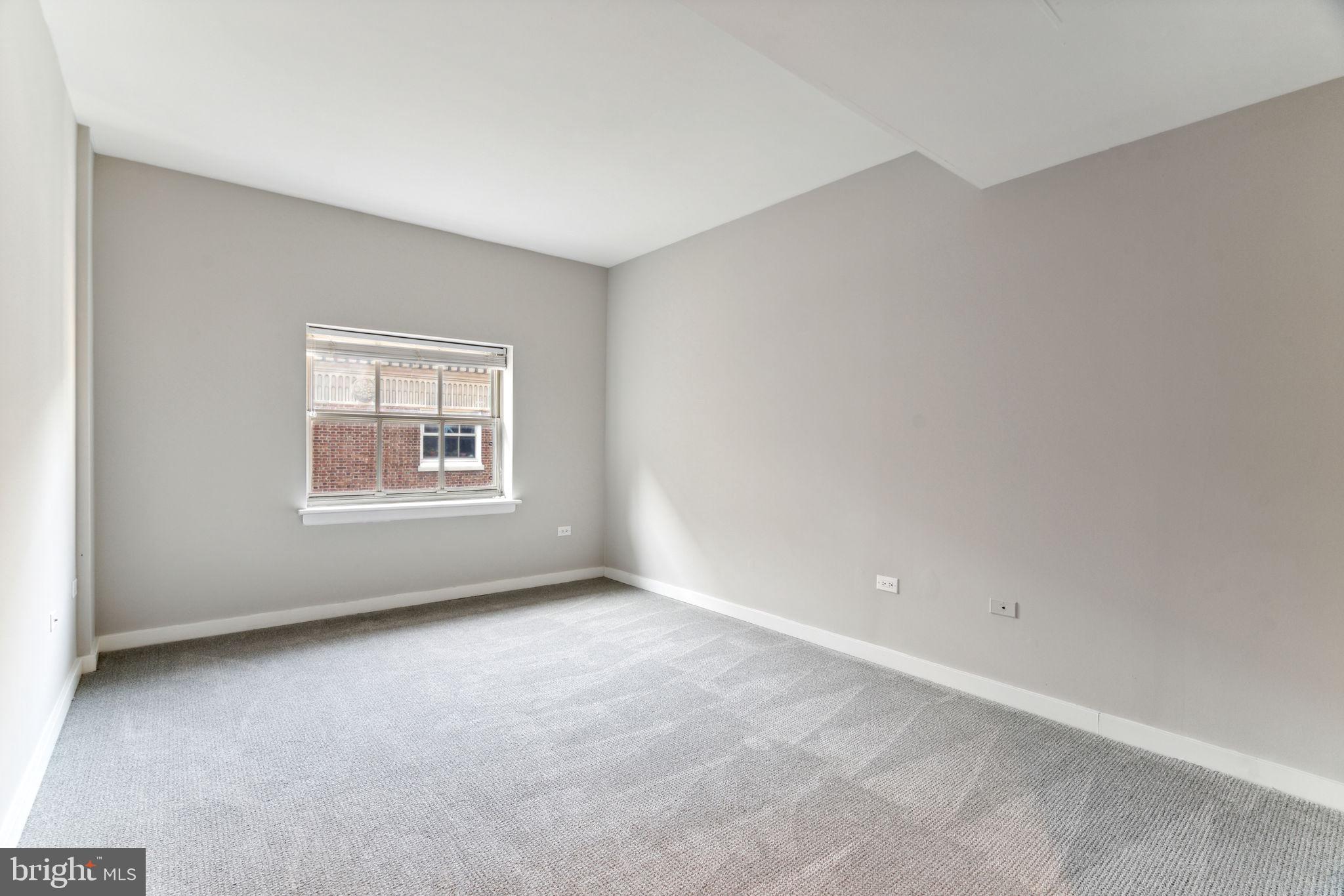 101-111 South 9th Street, Unit PH107 Philadelphia, PA 19107 - Photo 33 of 42 an empty room with a window