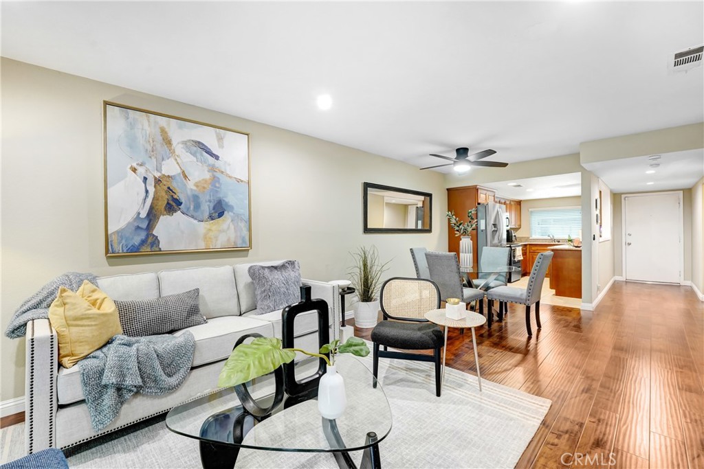 6882 Alondra Boulevard, Unit 26 Paramount, CA 90723 - Photo 2 of 14 a living room with furniture and wooden floor