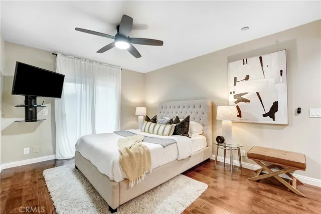 a bedroom with a bed and a desk