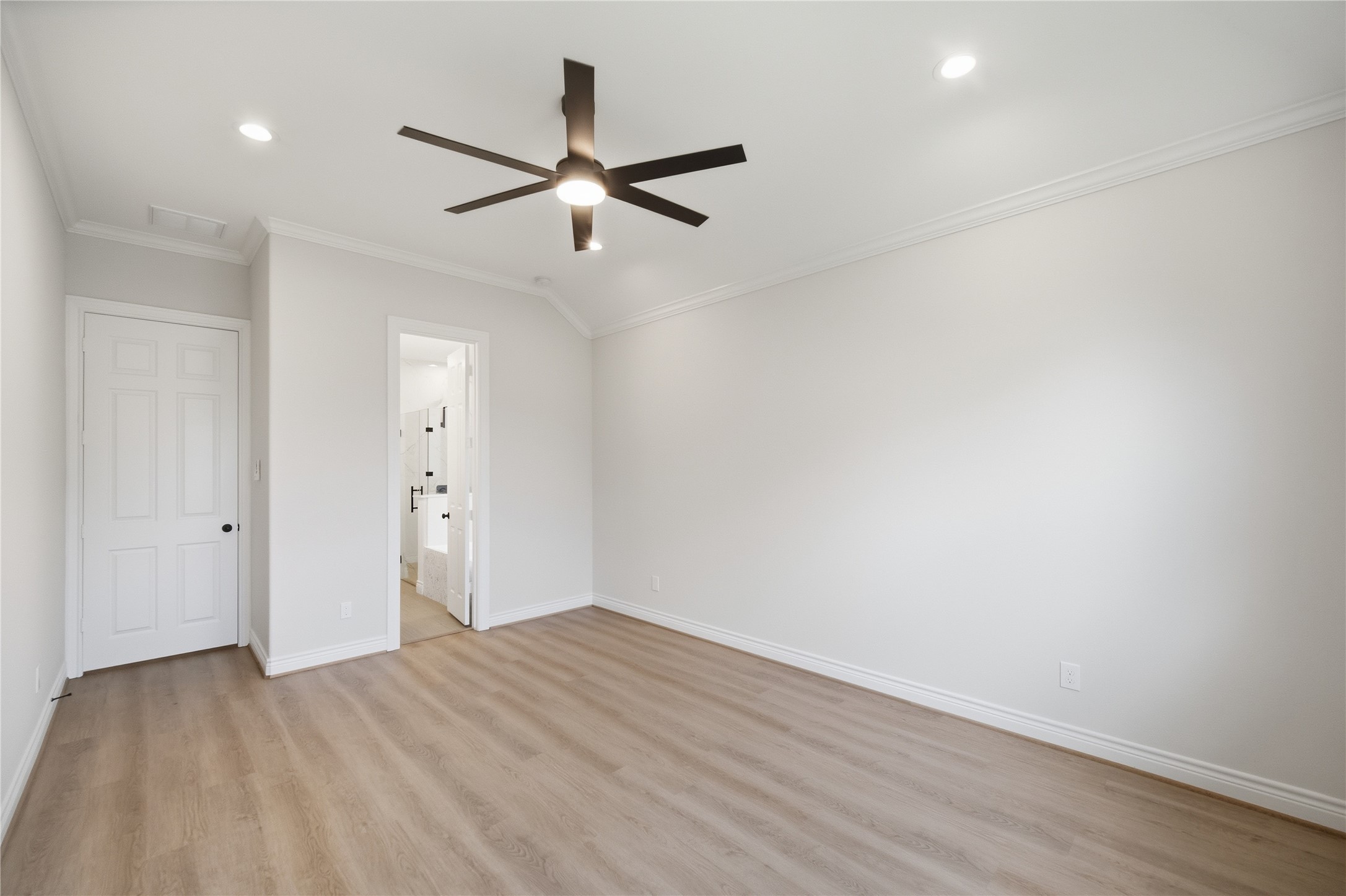 114 Par Circle La Porte, TX 77571 - Photo 17 of 33 The primary bedroom crown molding, recessed lighting, and three windows to allow for natural lighting.