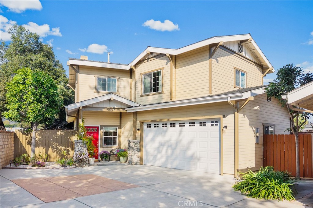 907 Royal Oaks Drive Monrovia, CA 91016 - Photo 1 of 1 a front view of a house with garden