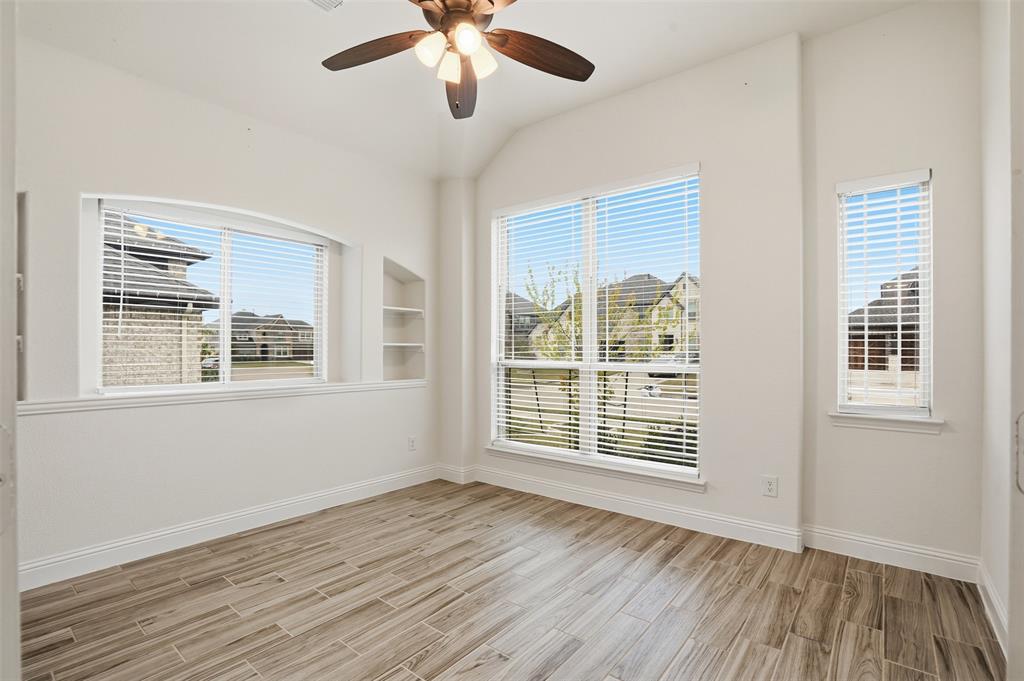 2604 Dylan Lane Mansfield, TX 76063 - Photo 18 of 33 a view of an empty room with wooden floor and a window