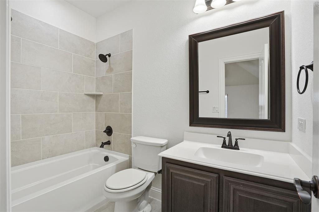 2604 Dylan Lane Mansfield, TX 76063 - Photo 23 of 33 a bathroom with a sink toilet vanity tub and shower
