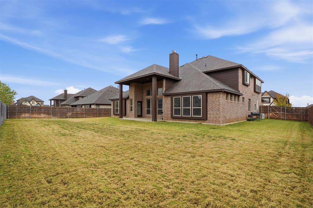 2604 Dylan Lane Mansfield, TX 76063 - Photo 30 of 33 a front view of a house with a garden