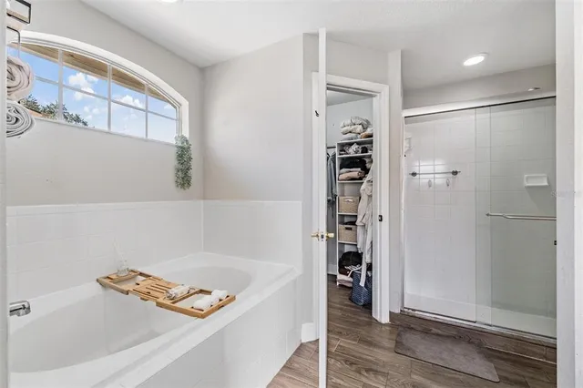 a bathroom with a tub and a shower