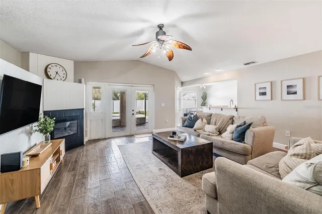 a living room with furniture and a flat screen tv