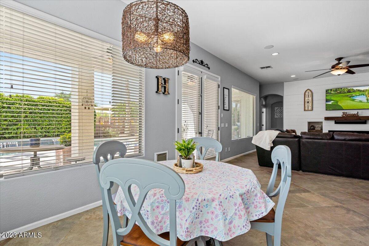 6730 Rachael Way Gilbert, AZ 85298 - Photo 27 of 77 a view of a dining room with furniture