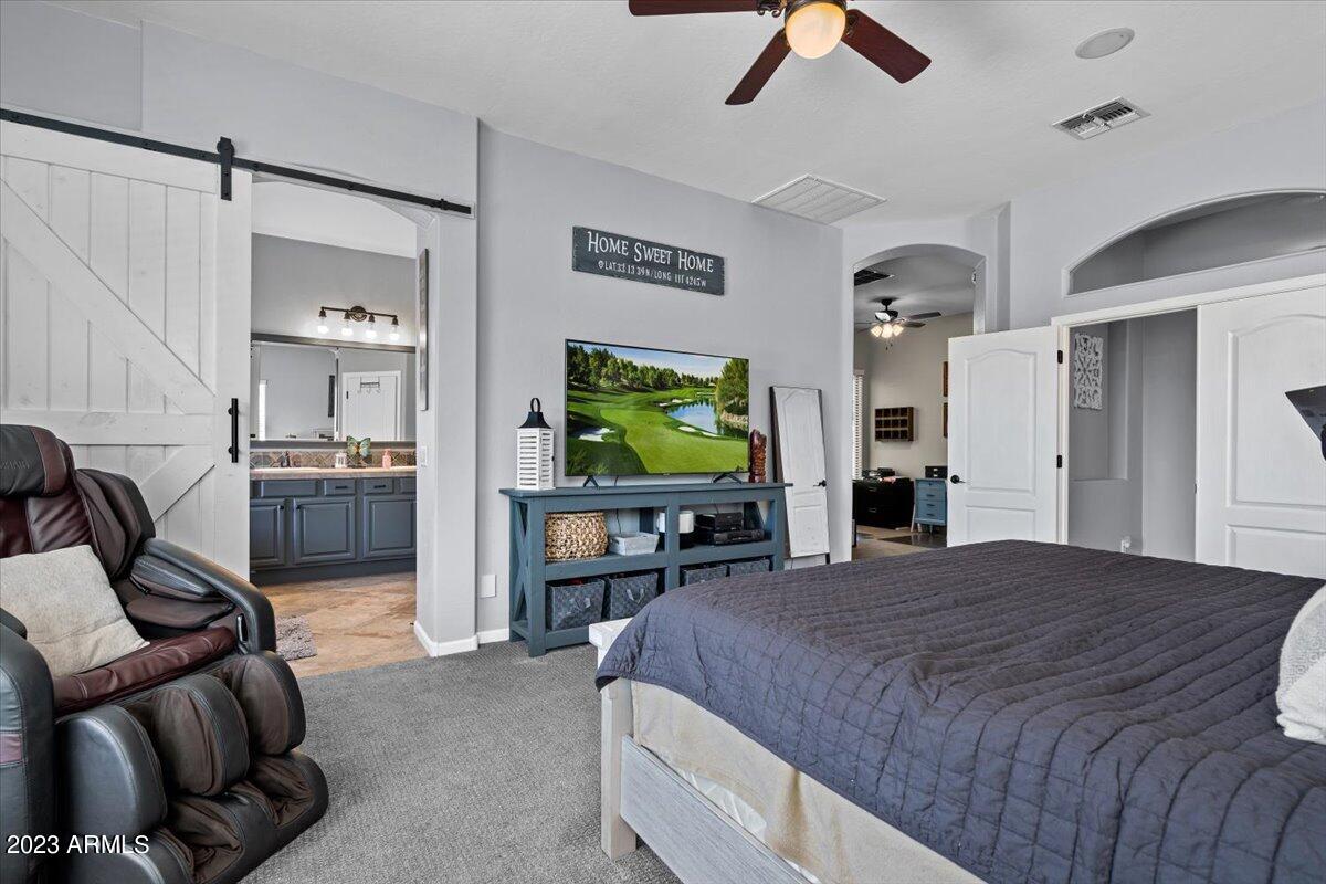 6730 Rachael Way Gilbert, AZ 85298 - Photo 31 of 77 a bedroom with a bed and furniture