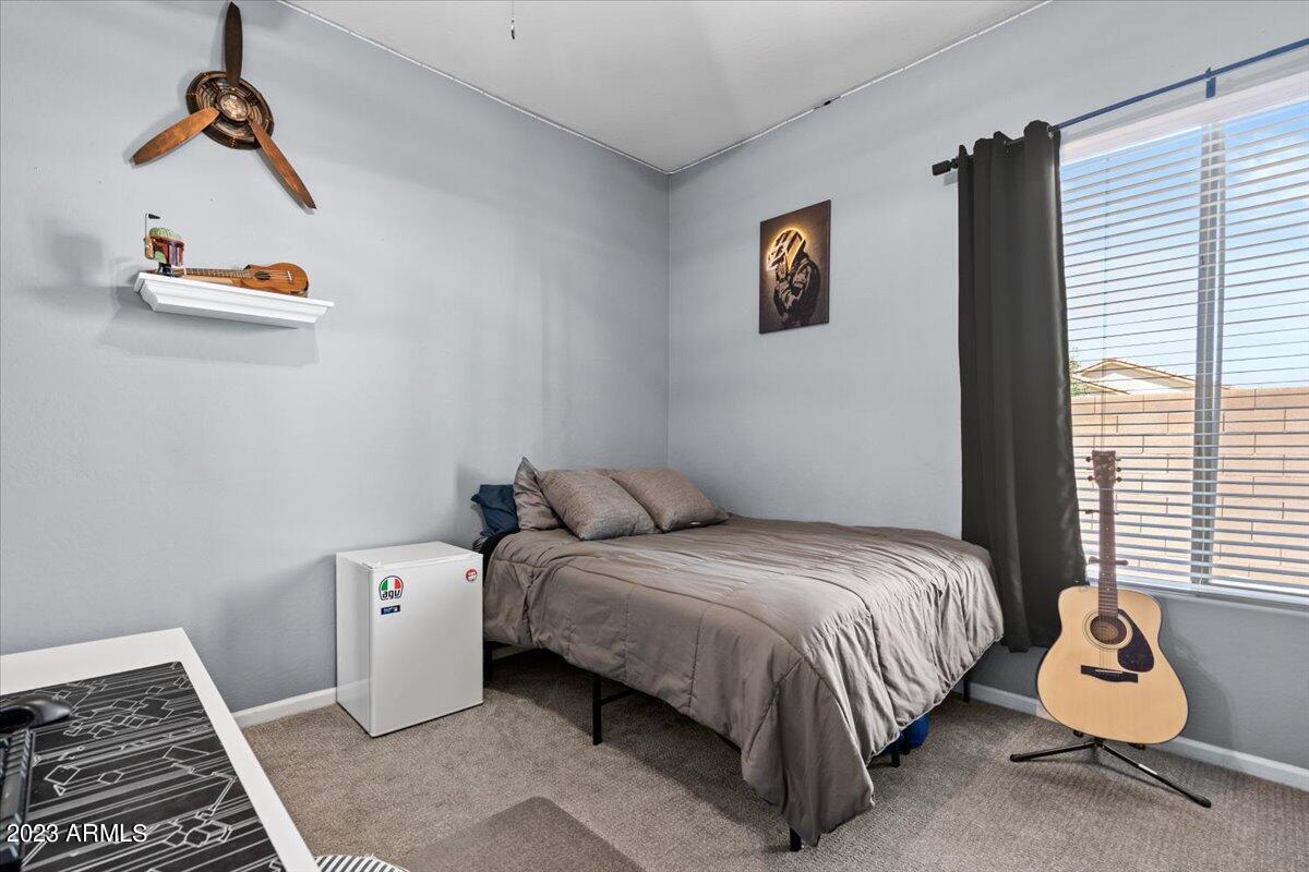 6730 Rachael Way Gilbert, AZ 85298 - Photo 37 of 77 a bedroom with a bed and window