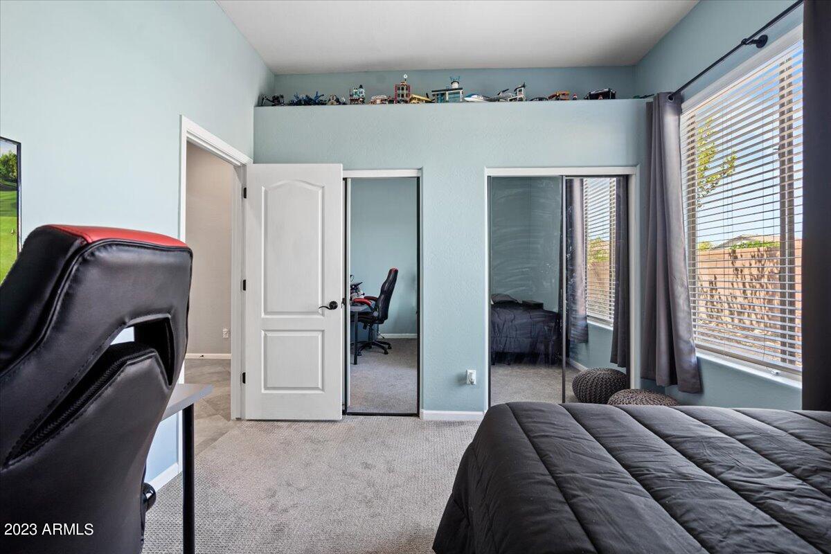 6730 Rachael Way Gilbert, AZ 85298 - Photo 40 of 77 a bedroom with a bed and a mirror