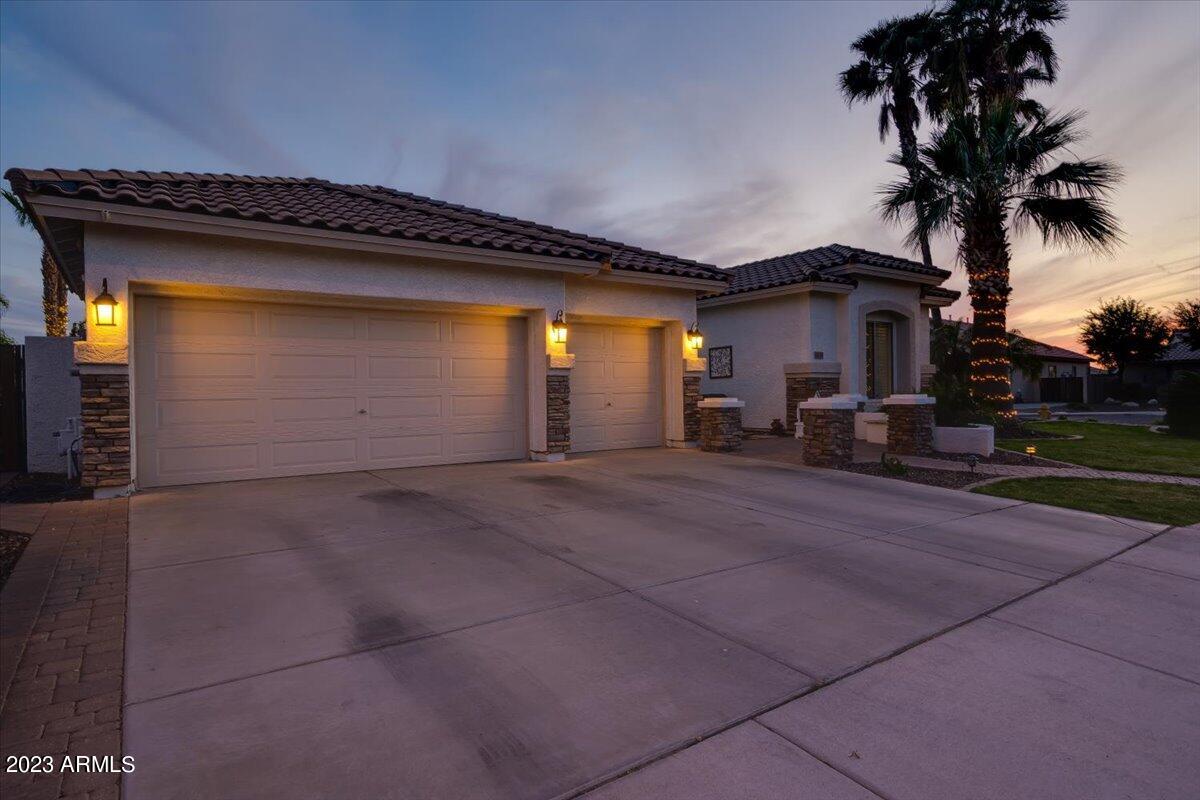 6730 Rachael Way Gilbert, AZ 85298 - Photo 4 of 77 a view of a house with a patio and a yard