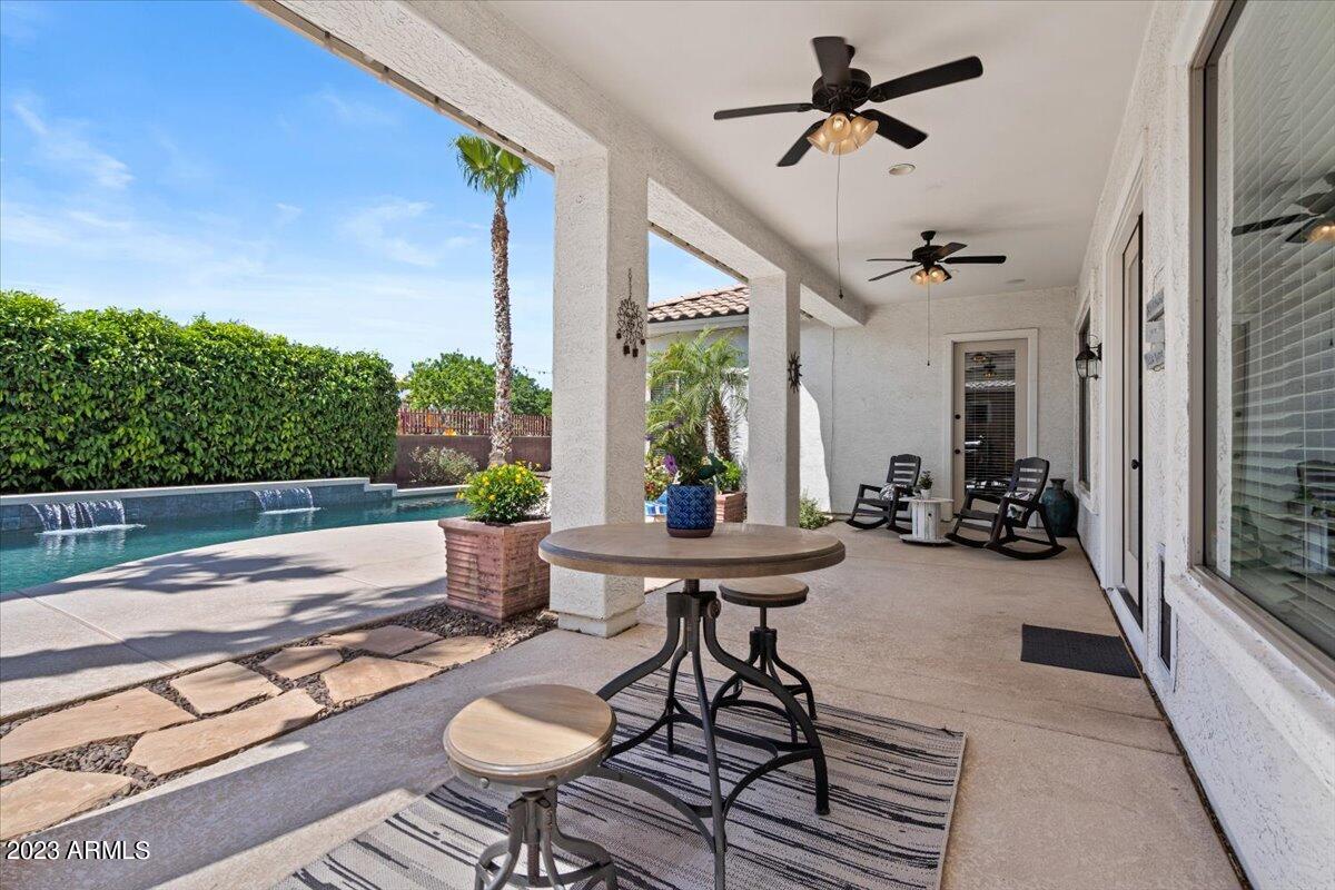 6730 Rachael Way Gilbert, AZ 85298 - Photo 46 of 77 a view of a patio with a dining table and chairs