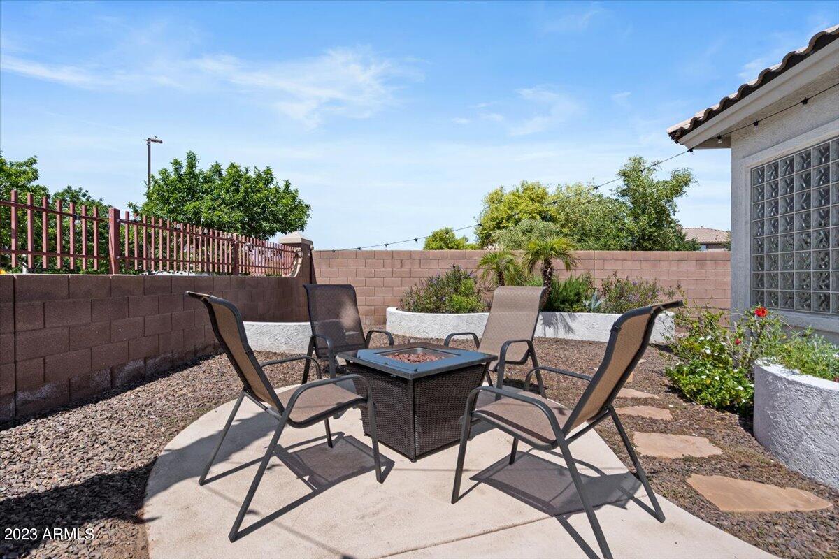 6730 Rachael Way Gilbert, AZ 85298 - Photo 55 of 77 a view of a chairs and table on the terrace