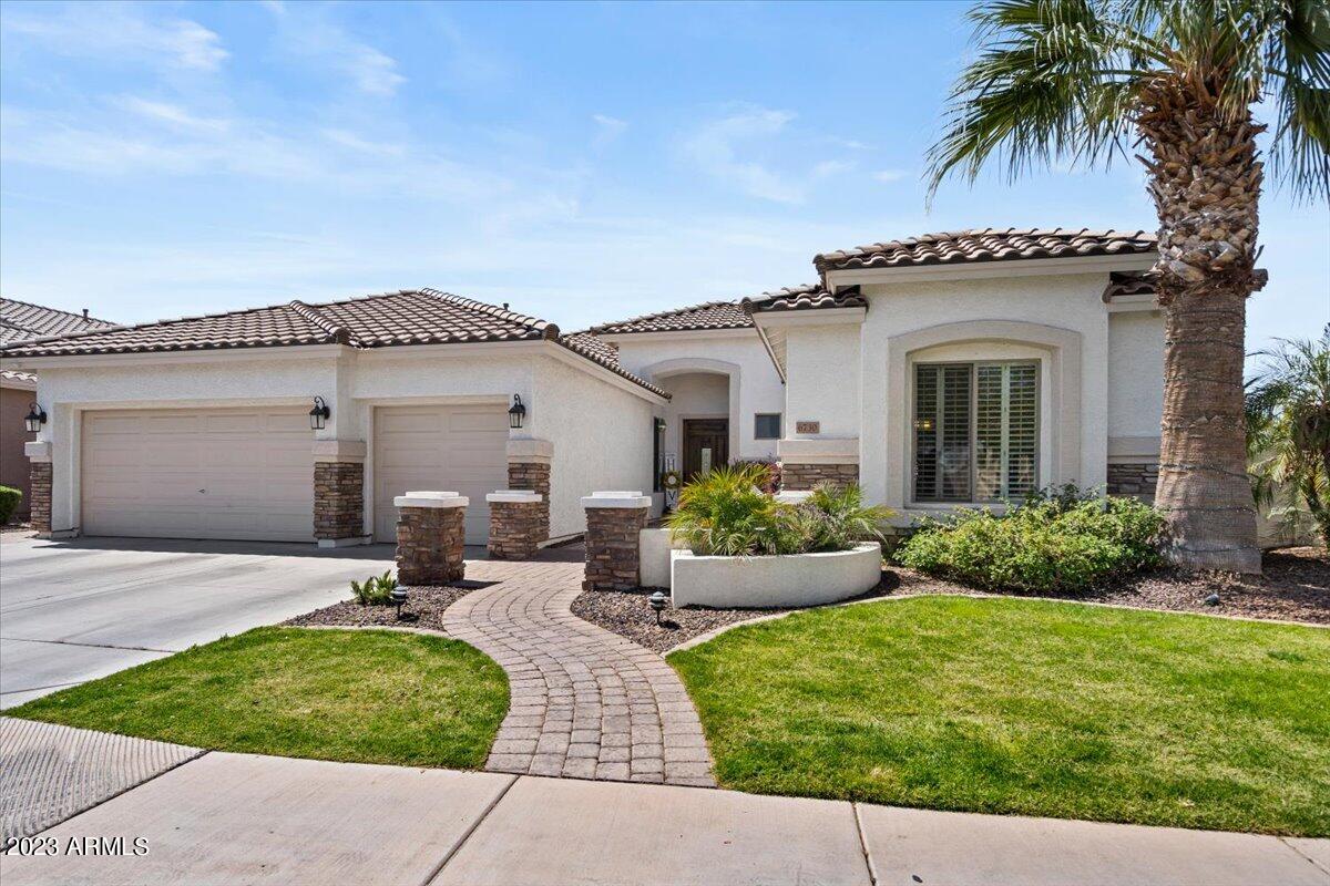 6730 Rachael Way Gilbert, AZ 85298 - Photo 6 of 77 front view of a house with a patio