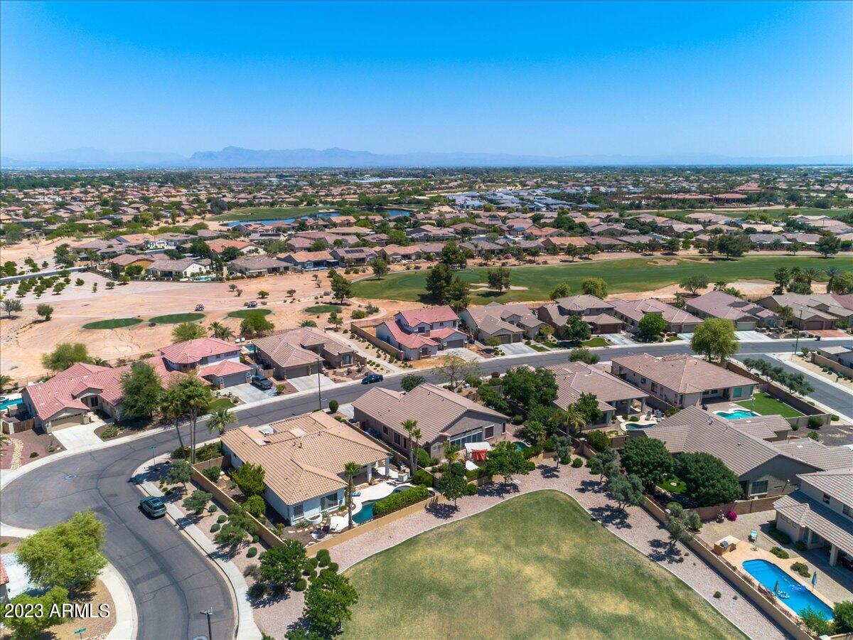6730 Rachael Way Gilbert, AZ 85298 - Photo 62 of 77 an aerial view of a city with lots of residential buildings ocean and mountain view in back