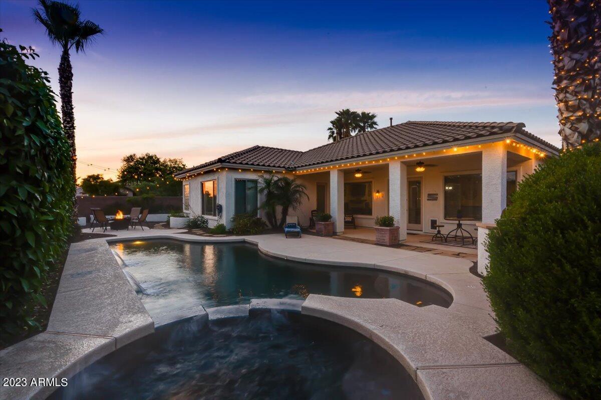 6730 Rachael Way Gilbert, AZ 85298 - Photo 69 of 77 a view of a house with swimming pool and sitting area