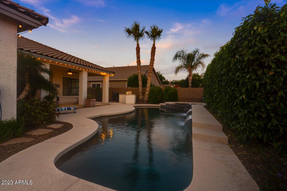 6730 Rachael Way Gilbert, AZ 85298 - Photo 74 of 77 a view of a house with swimming pool and porch with furniture