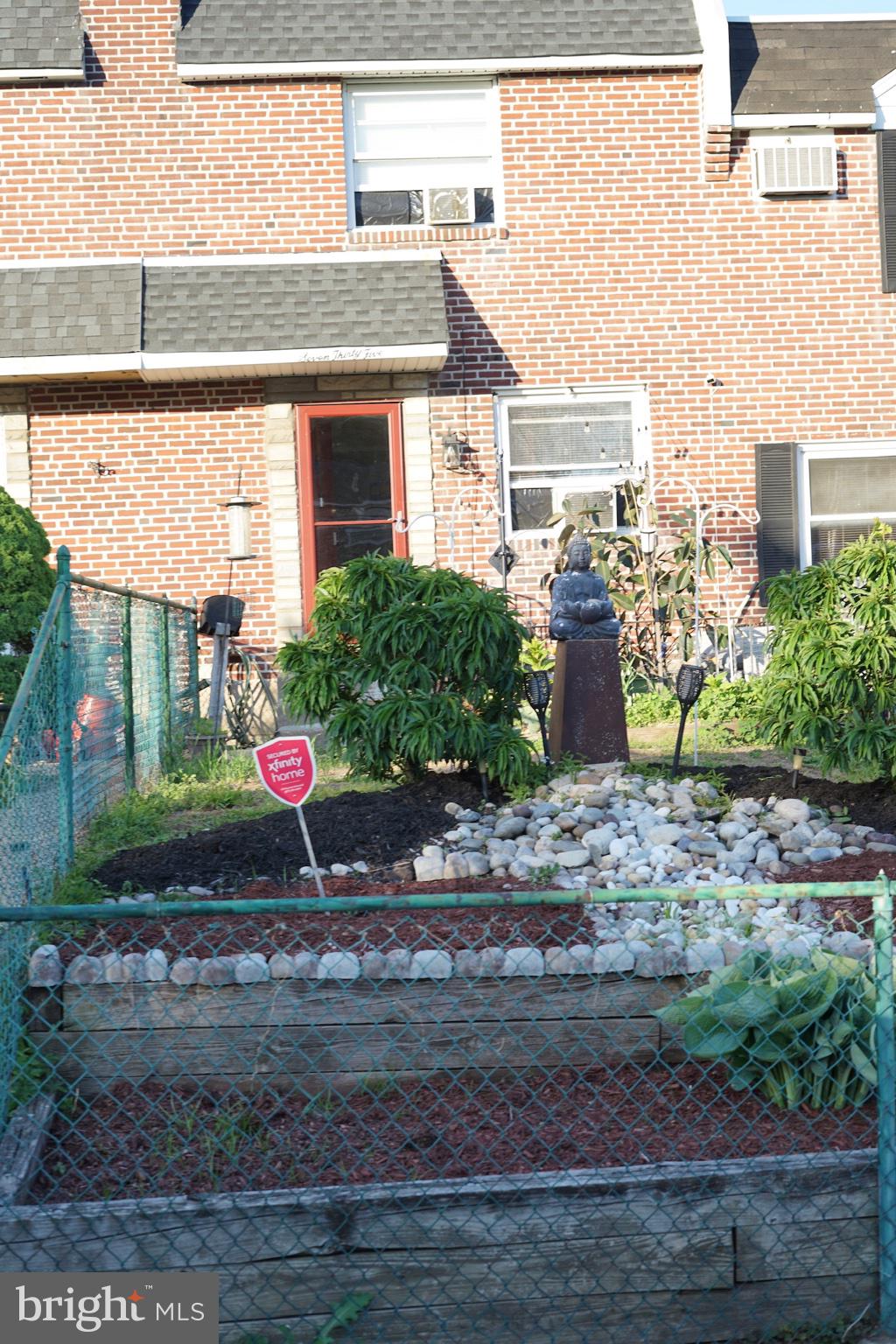 735 Grant Road Folcroft, PA 19032 - Photo 3 of 39 Charming garden with a serene statue.