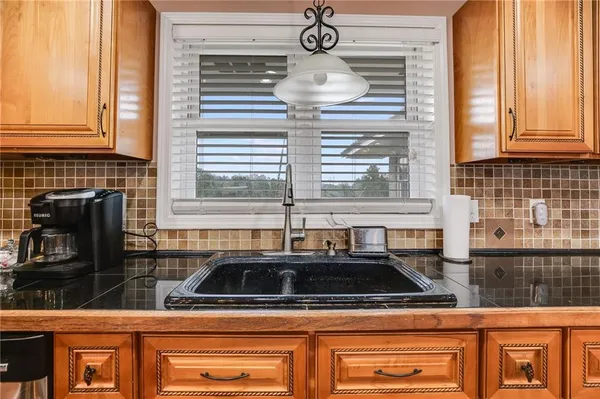 a kitchen with a stove and a sink