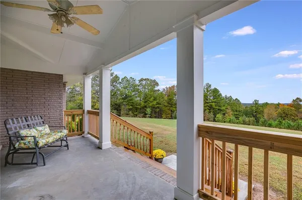 a view of a porch with furniture and a porch