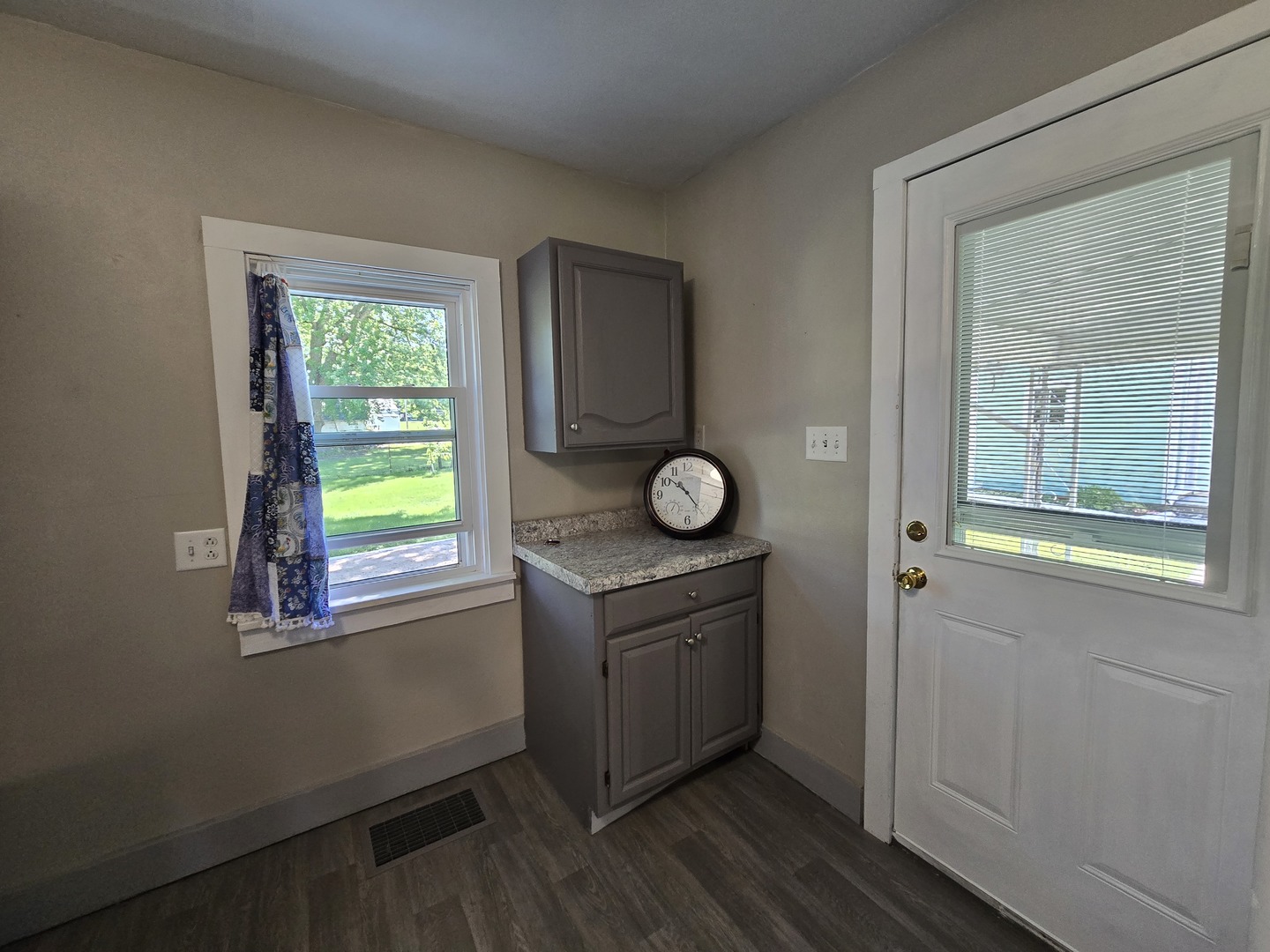 201 West Grove Road Sterling, IL 61081 - Photo 15 of 19 a kitchen with cabinets appliances and a window