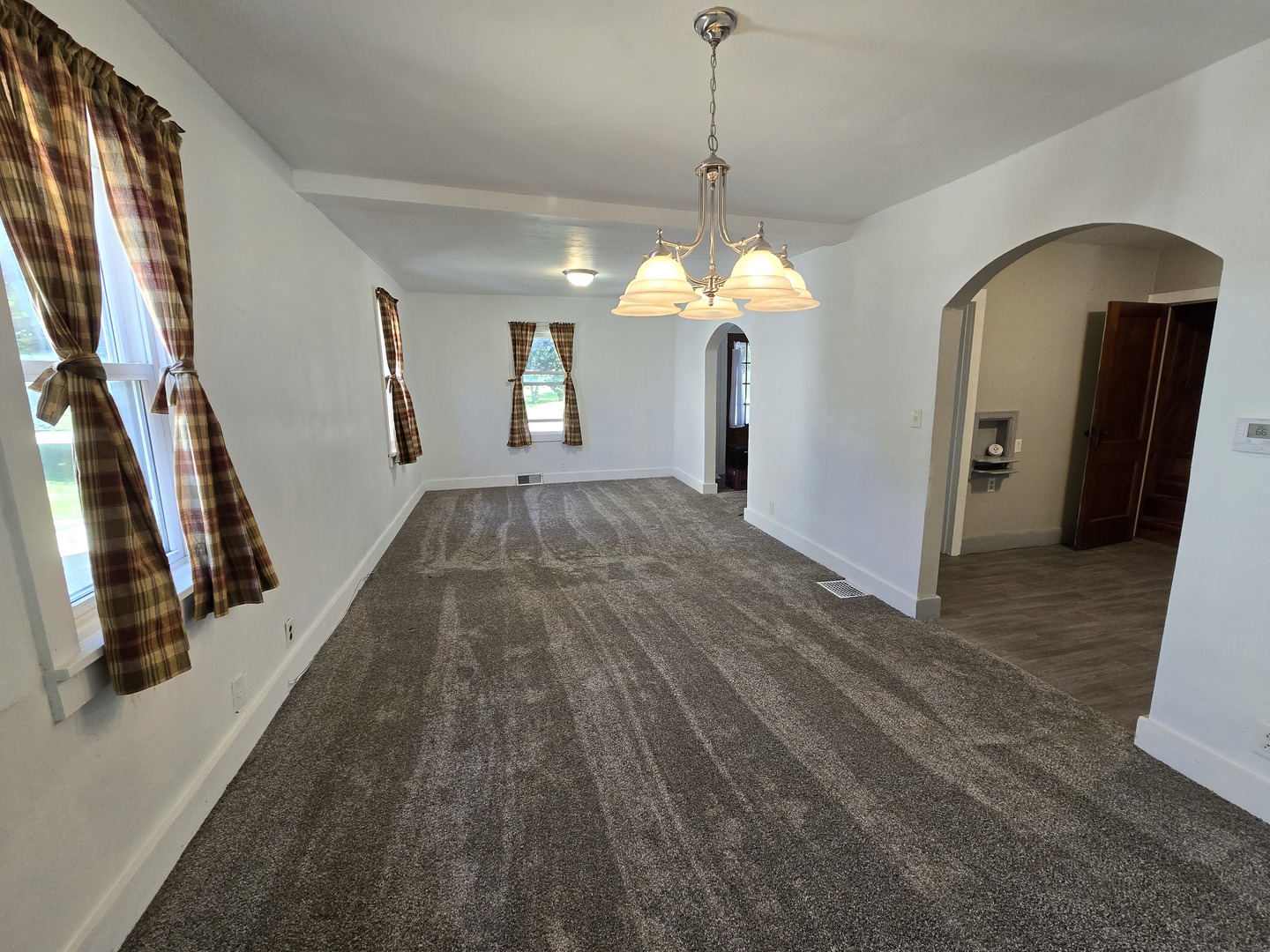 201 West Grove Road Sterling, IL 61081 - Photo 3 of 19 a view of a hallway with wooden floor and stairs