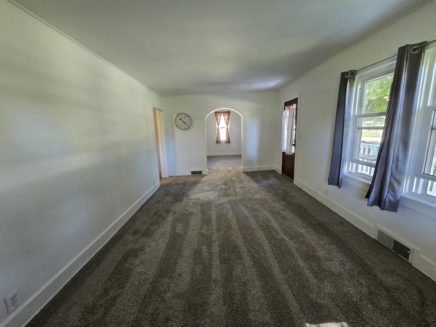 201 West Grove Road Sterling, IL 61081 - Photo 10 of 19 a view of a livingroom with wooden floor and windows