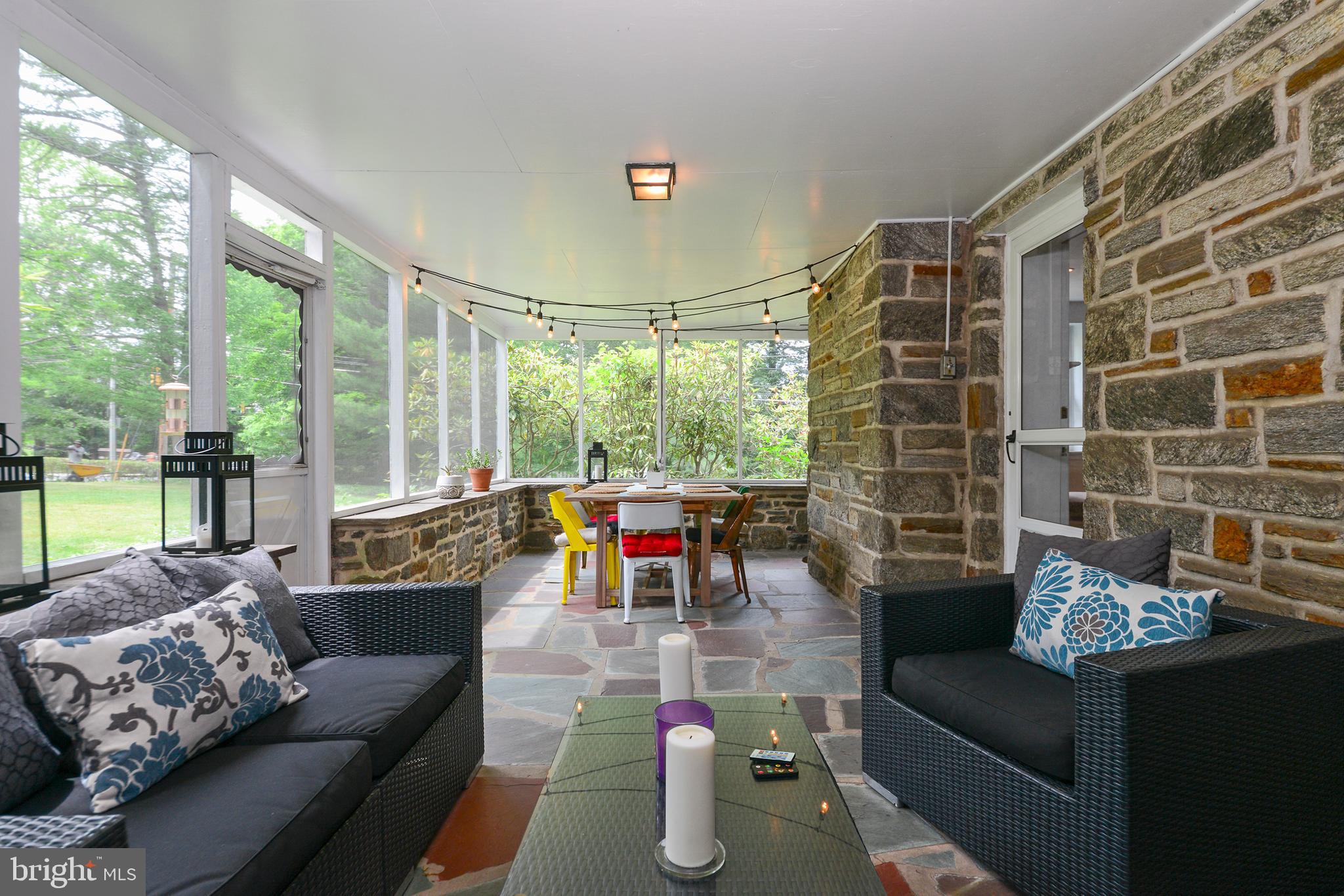 401 North Spring Mill Road Villanova, PA 19085 - Photo 29 of 39 Screen porch off the living room opens to yard