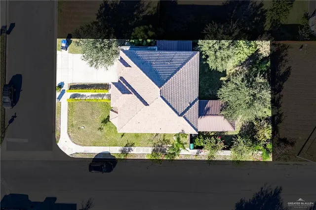 an aerial view of a house with yard swimming pool and outdoor seating
