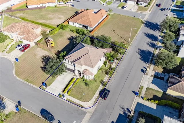 an aerial view of a house with garden space pool patio and outdoor seating