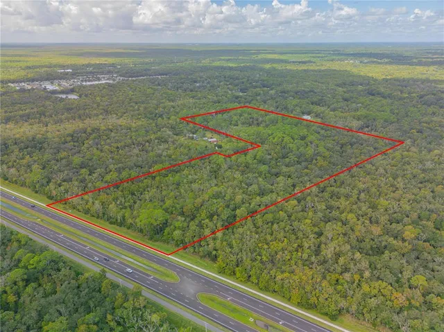 a view of a field with an ocean view