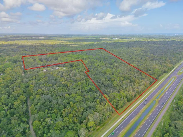 a view of a field with an ocean