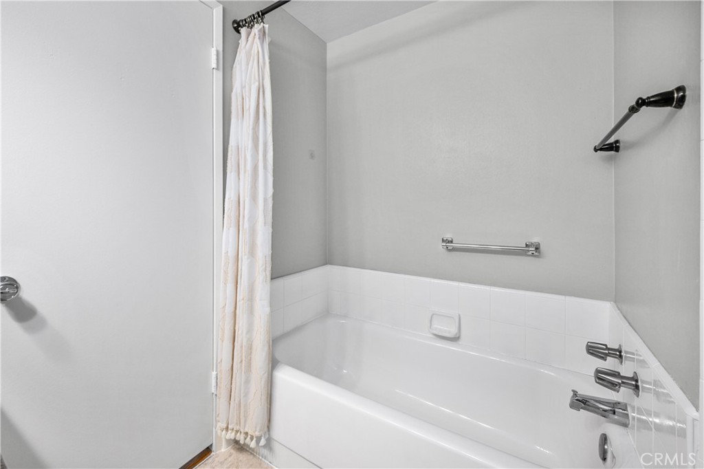 4237 Larwin Avenue Cypress, CA 90630 - Photo 27 of 48 a bathroom with a bathtub